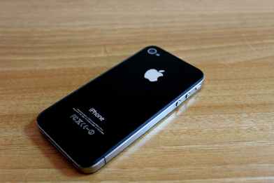 a smartphone on a wooden surface